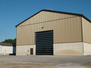 image of commercial building with poly garage doors